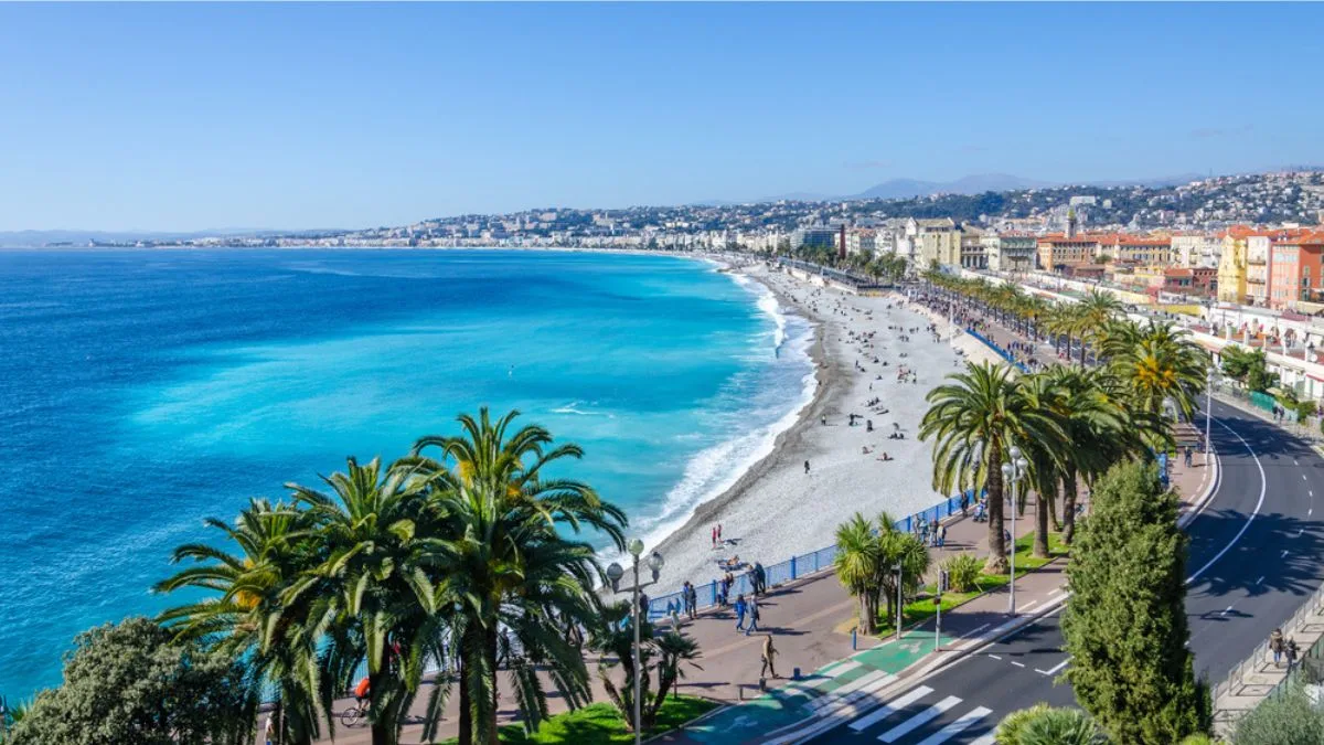 view over Nice's Promenade des Anglais with beach and azure Mediterranean waters
